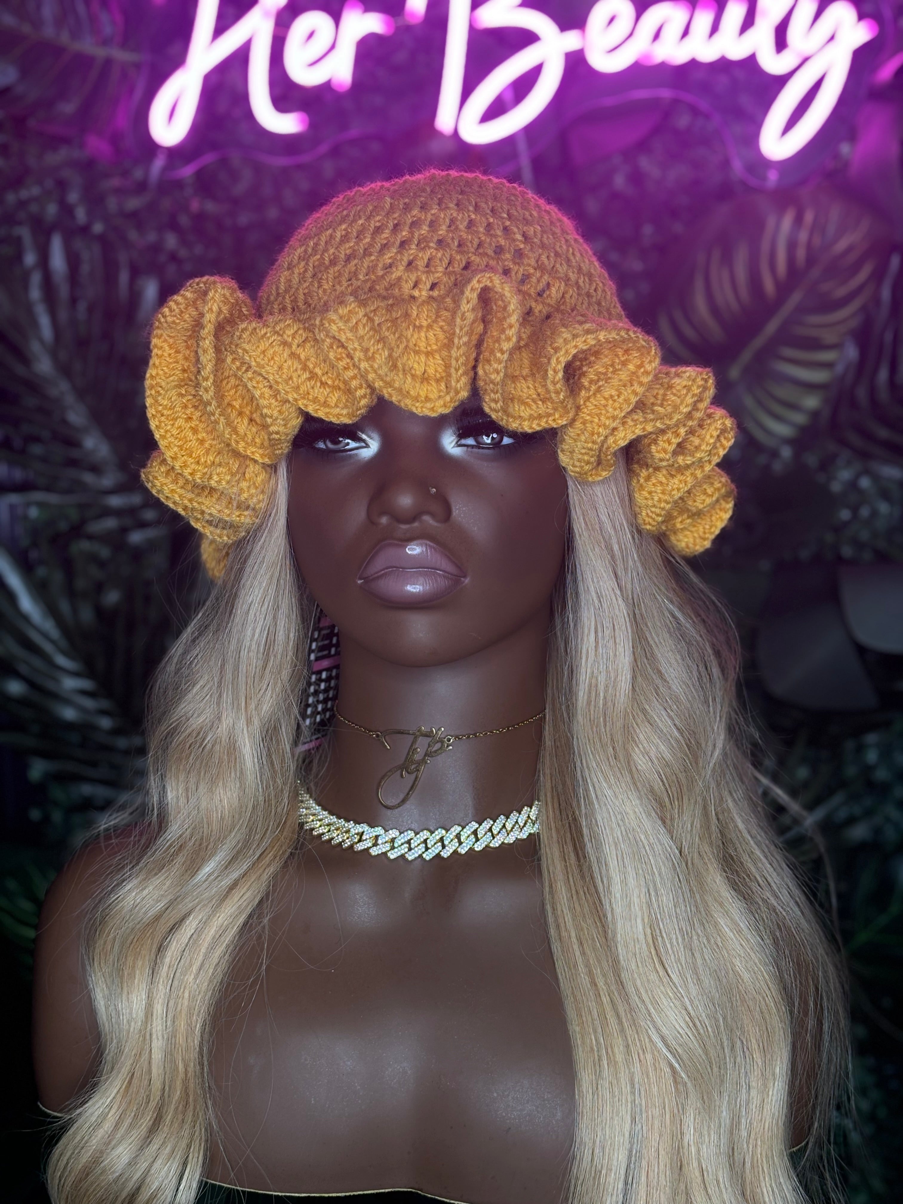 Handmade crochet hat with wide ruffled brim in soft pastel tones, perfect for stylish women